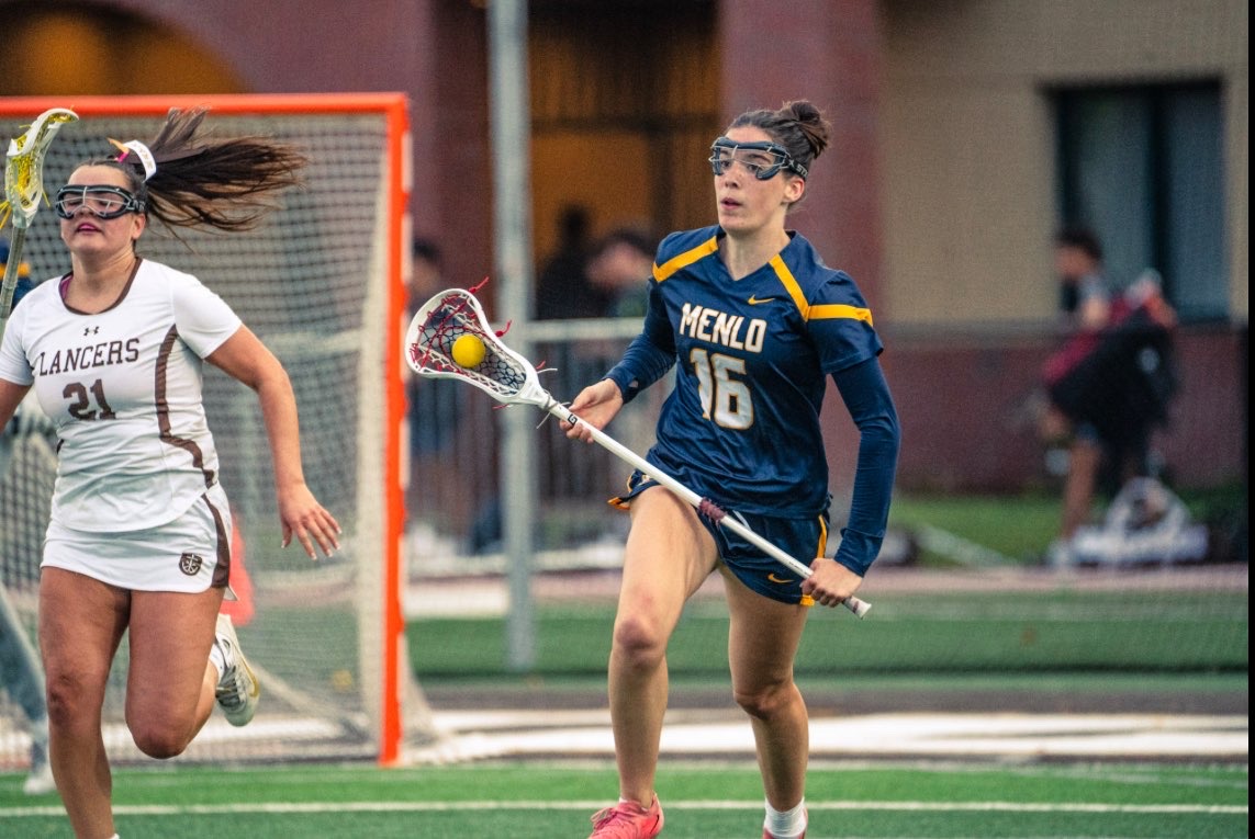 Senior Maren Mulloy cradles the ball down the field during a game in the 2024 season. 